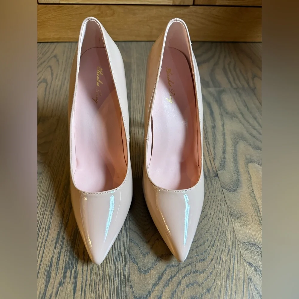 Worn once Elizabet Lang classic statement nude patent leather 4 inch heel shoes.